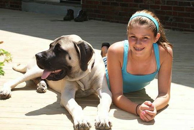 A girl wearing a blue tank top with Brooklyn