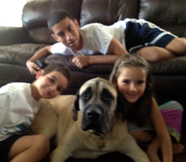 A group of three children posing with Dallas